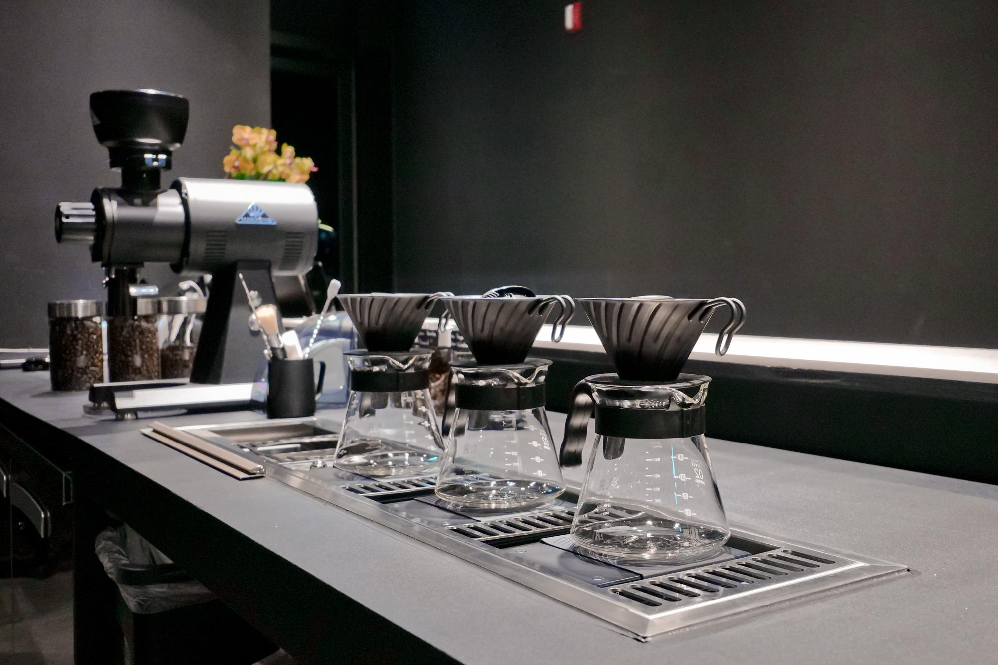 Studio kitchen workspace with stainless benches and modern equipment